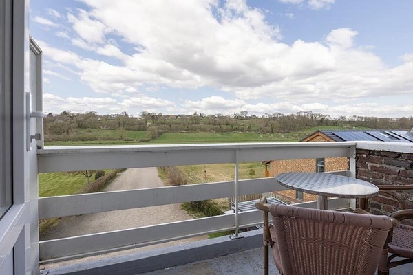 Breathe in open-air serenity with sweeping green valley views.