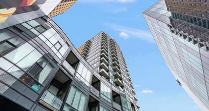 Modern High Rise Condo w Private Patio—Downtown