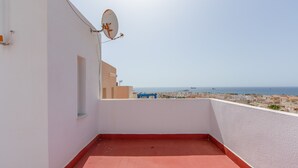 A rooftop terrace with a clear view of the sea, a satellite dish, and a red-tiled floor. - Holiday Home 'Fmr Fielato 15' with Private Terrace (Carboneras)