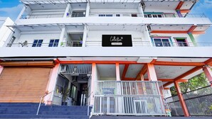 A multi-story building with a prominent sign reading 'Collection.' - Super Deluxe Room Ruthran Guest House (Tirukalukundram)