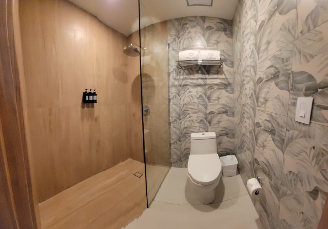 Shower, rainfall showerhead, towels, soap