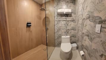 Shower, rainfall showerhead, towels, soap