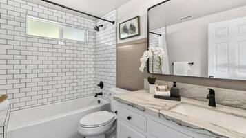 Hair dryer, towels, soap, toilet paper