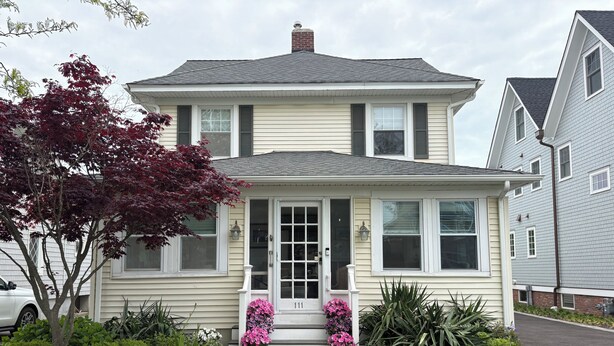 A two-story house with a front porch, a mailbox, and a driveway. - 5 bedroom house one block to Sea Girt beach (Sea Girt)