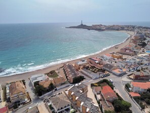 A coastal town with a beach, buildings, and a lighthouse. - Sweet Home Cabo de Palos by Interhome (Cabo de Palos)