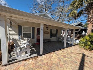 A house with a covered porch, white railings, and a number '407' sign. - Cute Beachy Bungalow-walking distance to beach-3 bd/2 ba house in NMB (North Myrtle Beach)