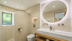 A modern bathroom with a shower, toilet, and vanity with a large mirror. - A Getaway to Les Granges: River 200 meters away on foot (Saint-Martin-d'Ardèche)