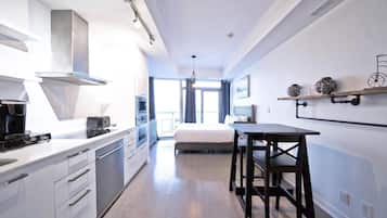 Classic Studio Suite, 1 Queen Bed with Sofa bed, Non Smoking, Private Bathroom | Living area | 50-inch TV with digital channels