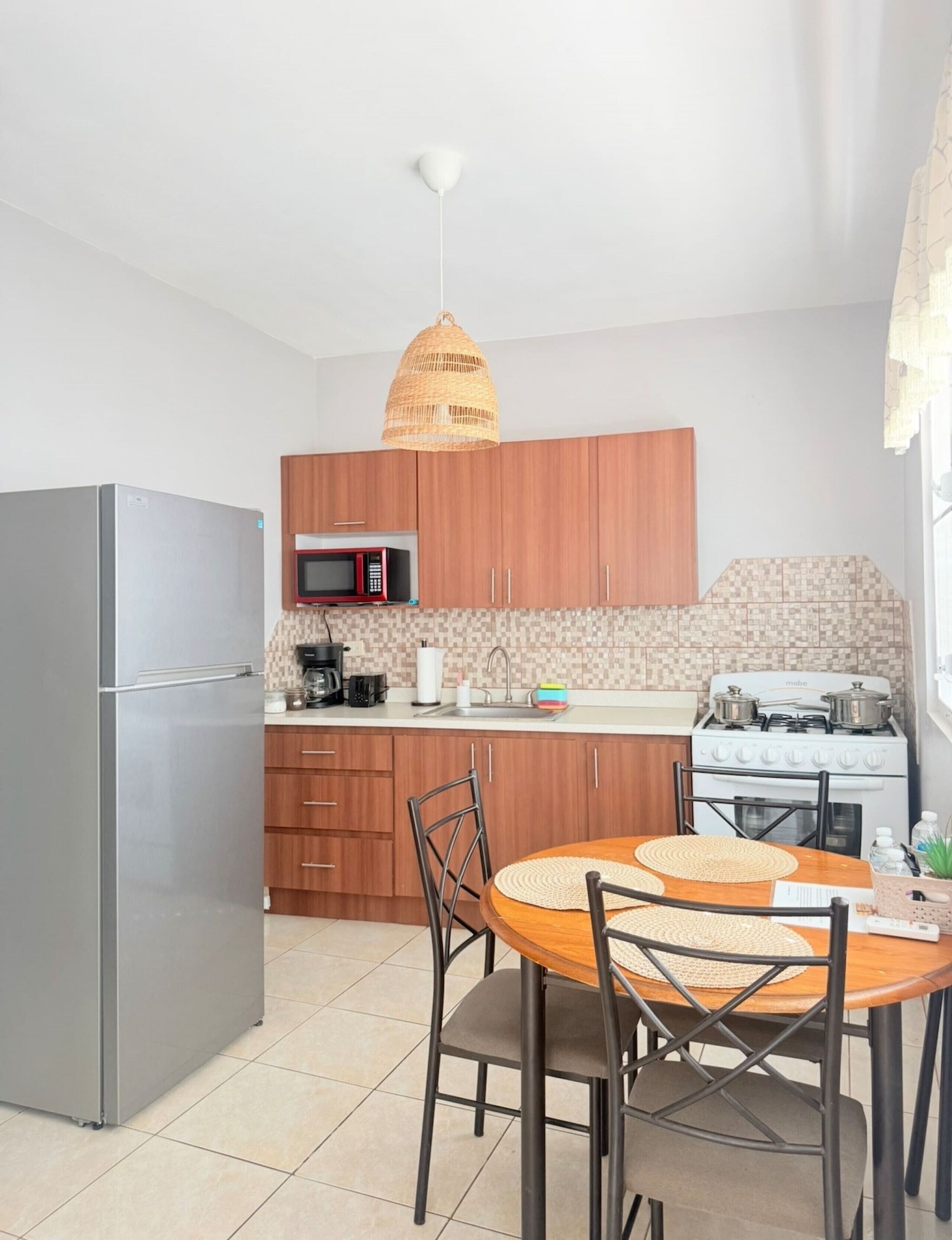 Coffee/tea maker, fridge, microwave, oven