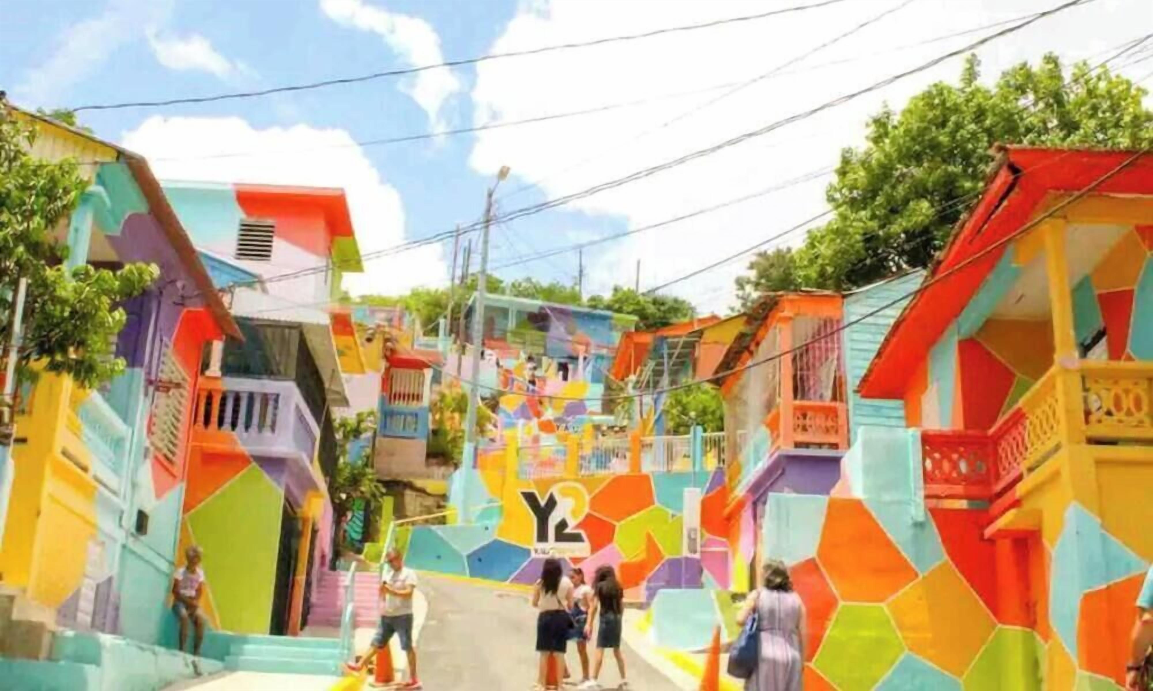 A colorful street with buildings painted in various bright colors.