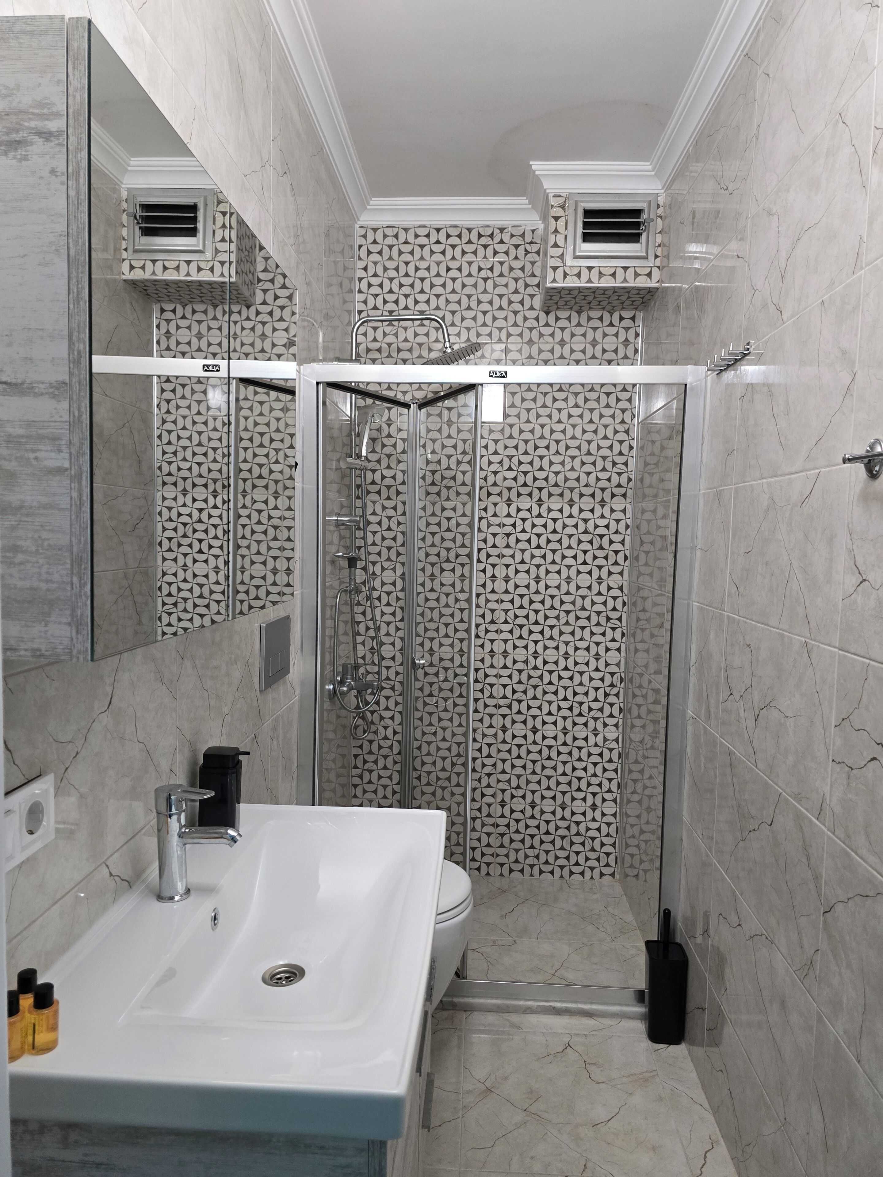 Shower, hair dryer, slippers, towels