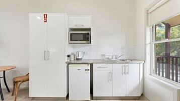 Microwave, toaster, high chair, cookware/dishes/utensils