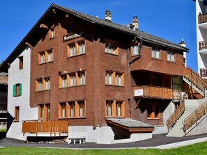 A traditional chalet-style building with a sign indicating it is a guesthouse. - Sonnenhügel Appartement/Fewo 8-Bettwohnung Nr. 1 by Interhome (Saas-Fee)