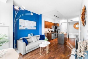 Deluxe Apartment, Balcony, City View | Living area - AOC Suites - High-Rise Condo (Toronto)