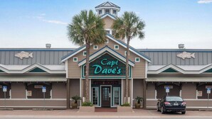 A seafood restaurant named 'Capt. Dave's' with a prominent sign, a parking lot, and a car parked in front. - 805 Gulf Front Views & Rare Gulf Front Pool ~ Gorgeous 2-bdm ~ Book Sept 28th (Destin)
