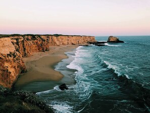 A coastal landscape with cliffs and a beach. - Pool Sea and Sunshine (Aptos)