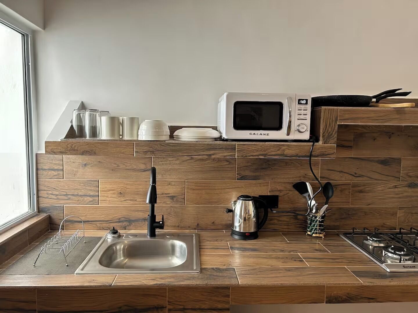 Microwave, coffee/tea maker, cookware/dishes/utensils
