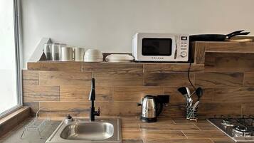 Microwave, coffee/tea maker, cookware/dishes/utensils