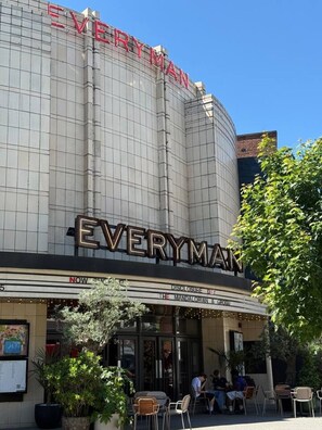 A theater with the name 'EVERYMAN' on the facade, featuring a marquee with 'DISCLOSURE DAY' and 'THE MANDALORIAN & GRUUL' listed. - Clean Cozy Stay With All Essentials Included (London)