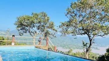 Outdoor pool, open 8:00 AM to 9:00 PM, pool umbrellas, pool loungers