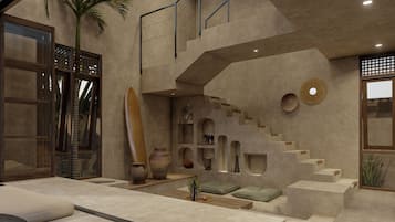 Um interior moderno com escada, área de estar e elementos decorativos.