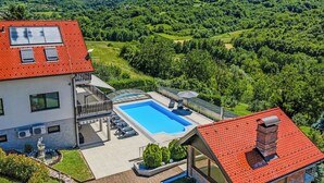 A house with a swimming pool, a balcony, and a view of a green valley. - Grandpa's House With Pool, Gornja Stubica, Croatia (Gornja Stubica)