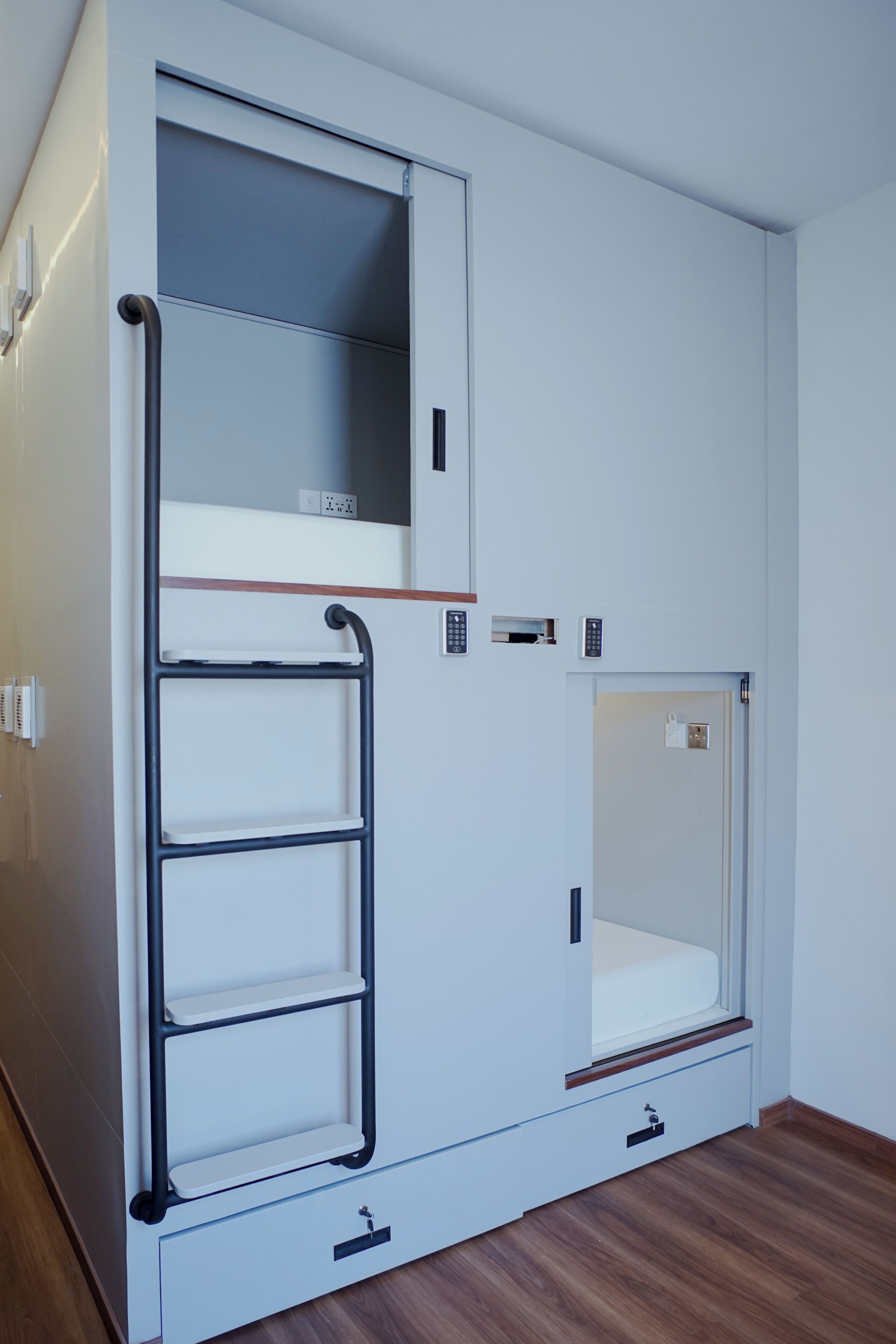 A bunk bed with a pull-out desk and a small closet.