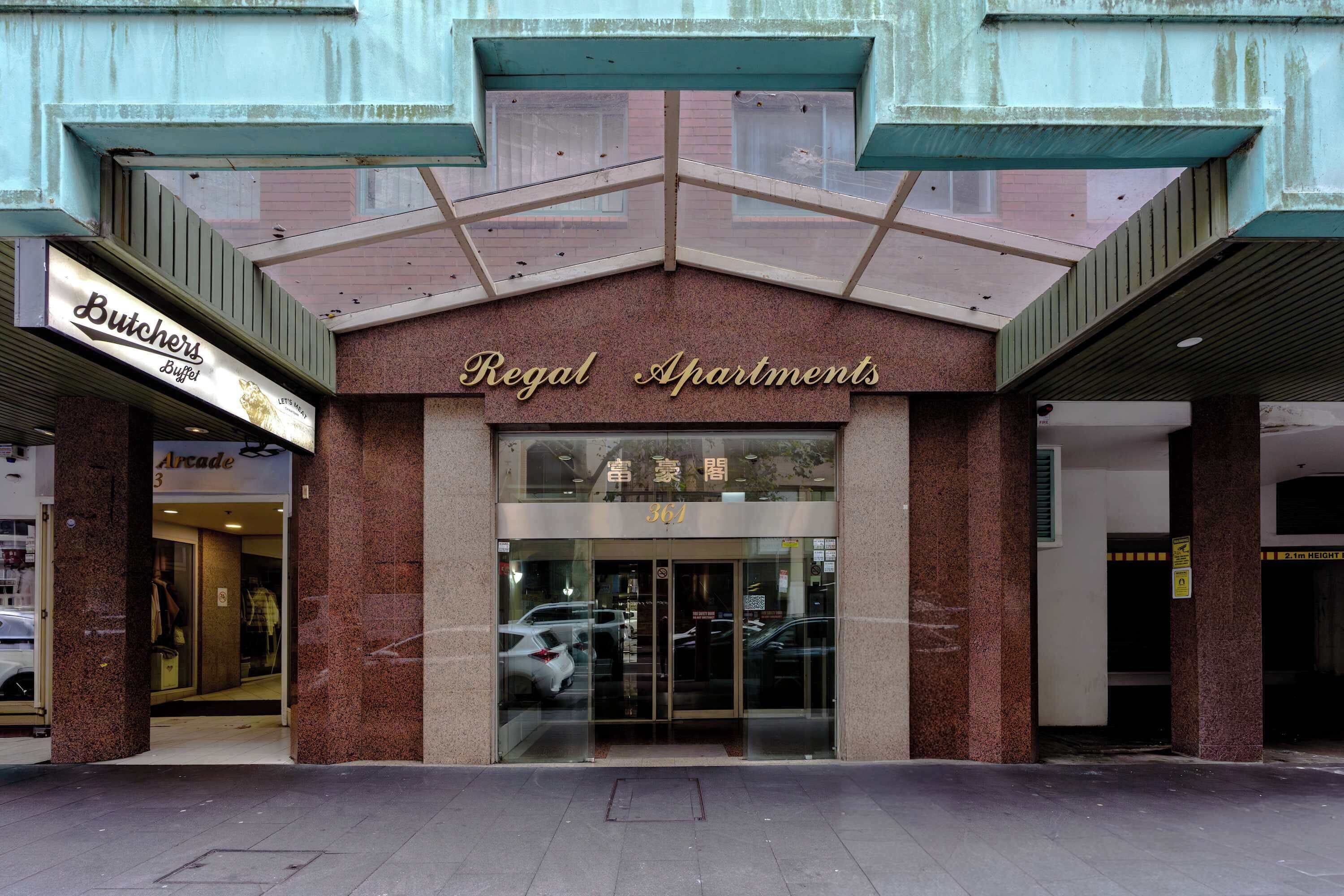 Welcoming entrance to Regal Apartments, with a sheltered walkway and easy street access. The building offers a secure, convenient base for exploring everything the surrounding city area has to offer. 