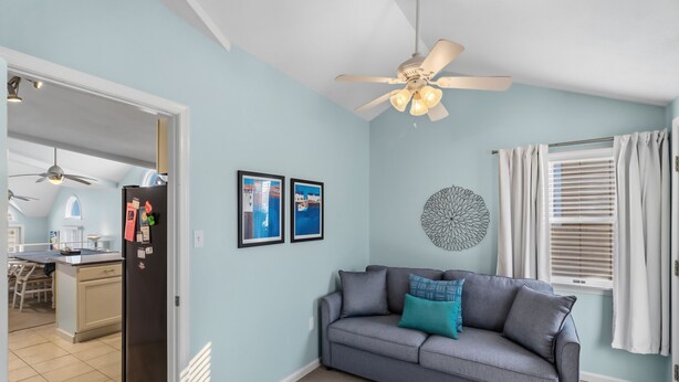 A living room with a grey sofa, a ceiling fan, and a window with blinds. - Ocean City NJ Beach Block 5BR/2.5BA - Steps to Beach (Ocean City)