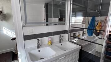 Shower, hair dryer, towels, soap
