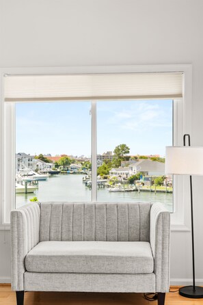 TV - Sunsets & Bay Views | Pool + Fishtails Rentals (Ocean City)