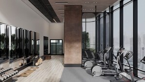 Een moderne sportschool met trainingsapparatuur, grote ramen en uitzicht over de stad.