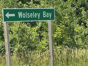 A directional sign for Wolsley Bay.