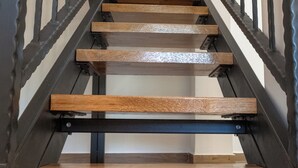 A wooden staircase with metal railings. - Blažov Dvor (Zaton)