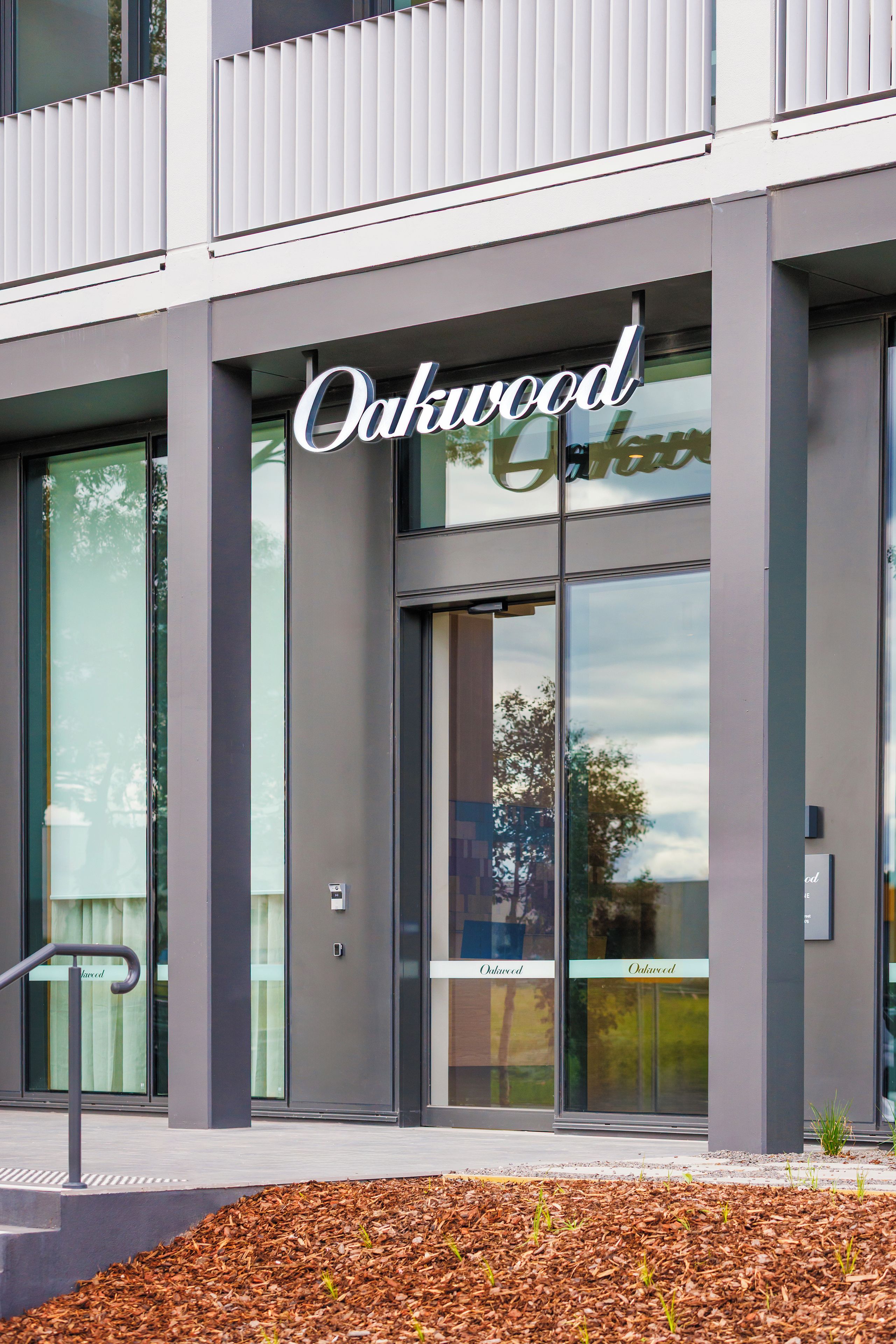 A building with the name 'Oakwood' prominently displayed on the facade.