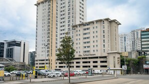A multi-story parking garage with a sign for 'Ty Pont Haearn' and a 'NCP' logo. - Student Only - Ty Pont Haearn - Cardiff (Cardiff)