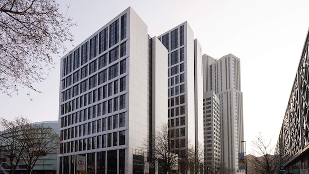 A modern building with a grid of windows, a pedestrian zone sign, and a delivery truck. - Student Only White Rose View (Leeds)