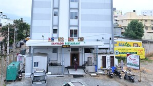 A multi-story hotel with a sign for 'SIIA Grand' and 'SAHYADRI RESTAURANT' on the ground floor. - HOTEL SIYAGRAND (Tirupati)