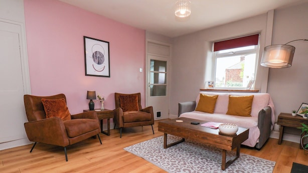 A living room with a sofa, two armchairs, a coffee table, and a patterned rug. - The Braes (Redcar)