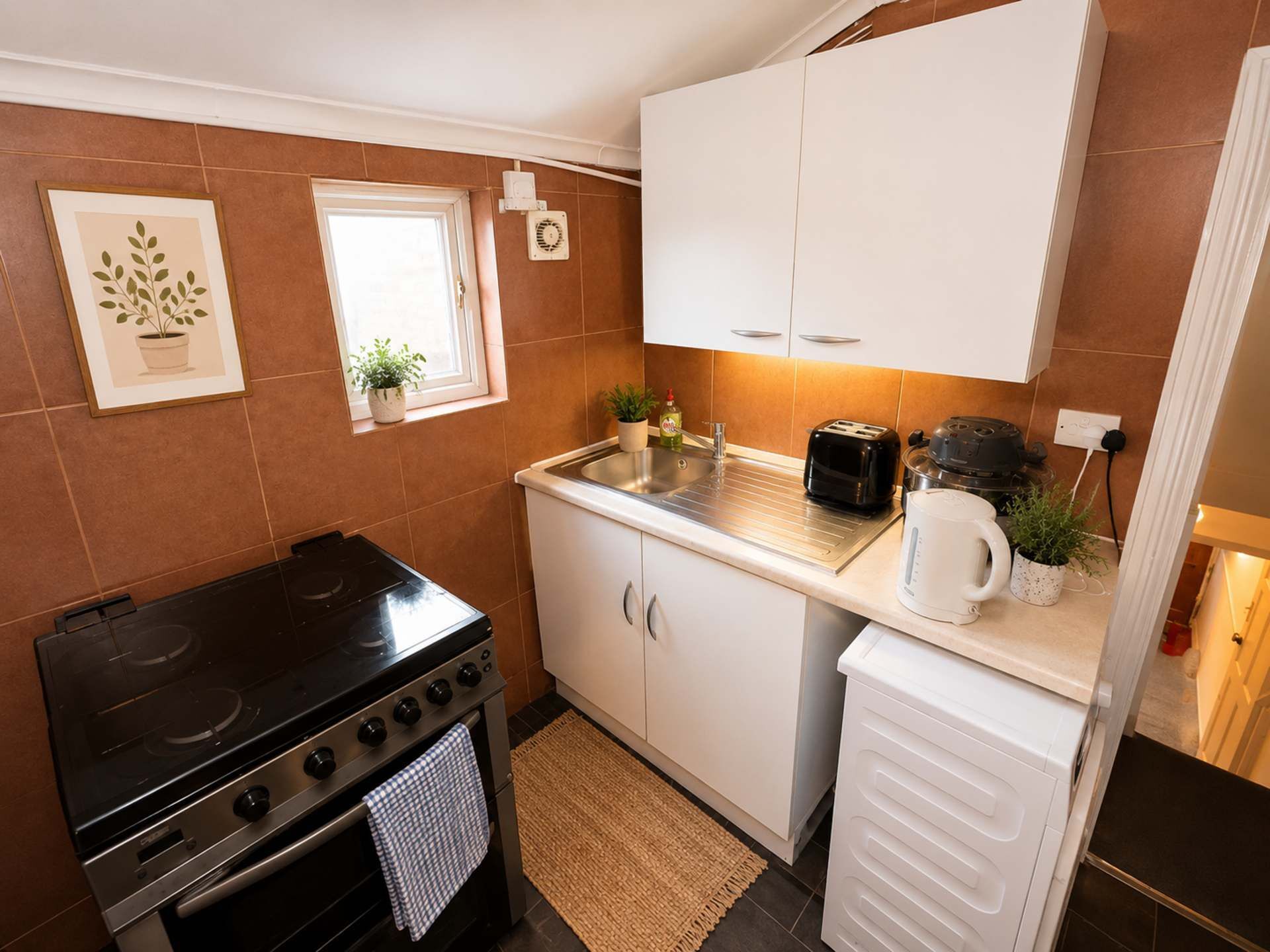 Fridge, stovetop, electric kettle, cookware/dishes/utensils