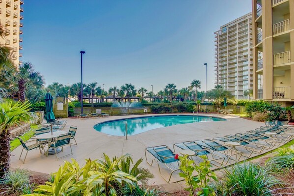 A pool area with lounge chairs and a sign indicating no diving allowed. - Royale Palms 1707 Elegant Oceanview w/Pool & Beach (Myrtle Beach)