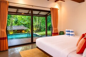 A bedroom with a large bed, a view of a swimming pool, and curtains.
