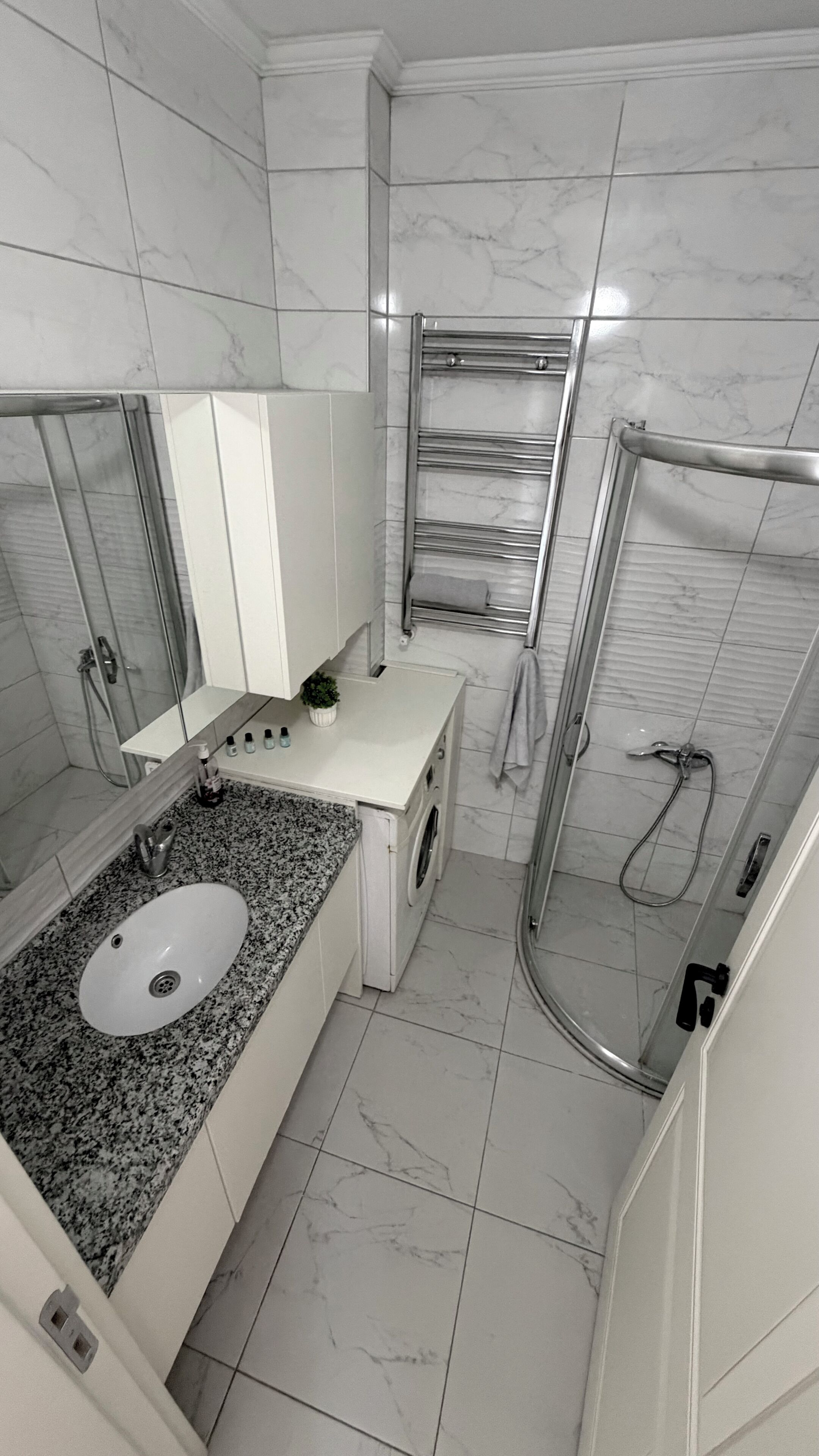 Shower, hair dryer, towels