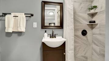 Shower, hair dryer, towels, shampoo