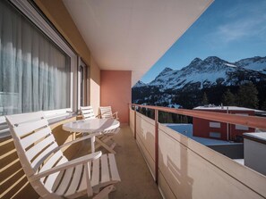 A balcony with a table and chairs, overlooking a mountainous landscape. - Paradies 606 Appartement/Fewo, Bad, WC, 2-Bettwohnung by Interhome (Arosa)