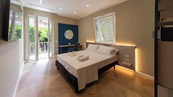 Luxury Apartment, Balcony, City View | Pillow-top beds, in-room safe, blackout curtains, iron/ironing board