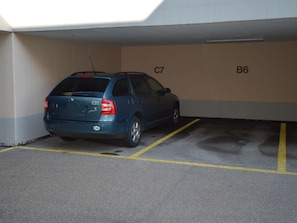 A parking garage with marked spaces C7 and B6. - Gentiana C-7 Appartement/Fewo, Dusche und Bad, WC, 2-Bettwohnung by Interhome (Arosa)