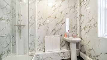 Shower, hair dryer, towels
