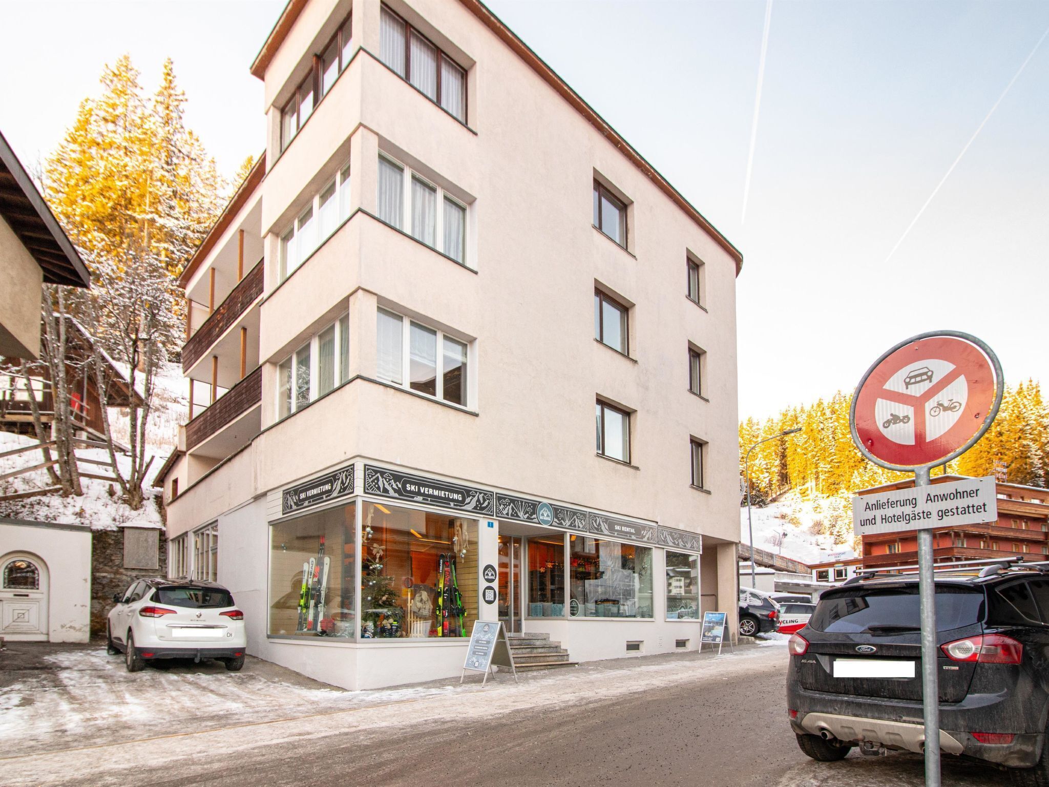 A multi-story building with a ski rental shop on the ground floor.