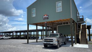 A two-story building with a sign reading 'Hopedale Hideaway.'